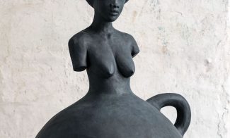 A sculpture by Simone Leigh of a female figure.
