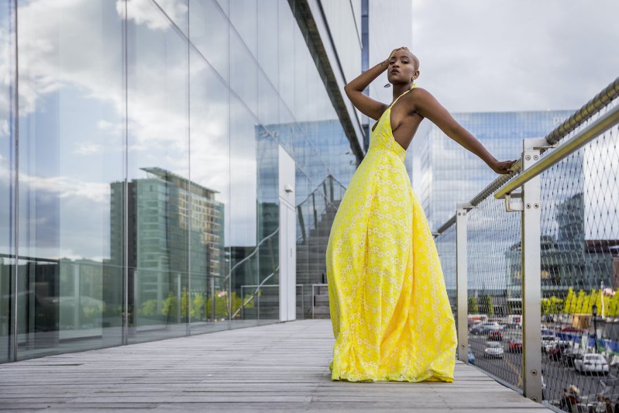 Model in yellow dress posing outside the ICA building