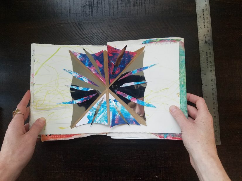 Opening a book to show a bright pop-up card