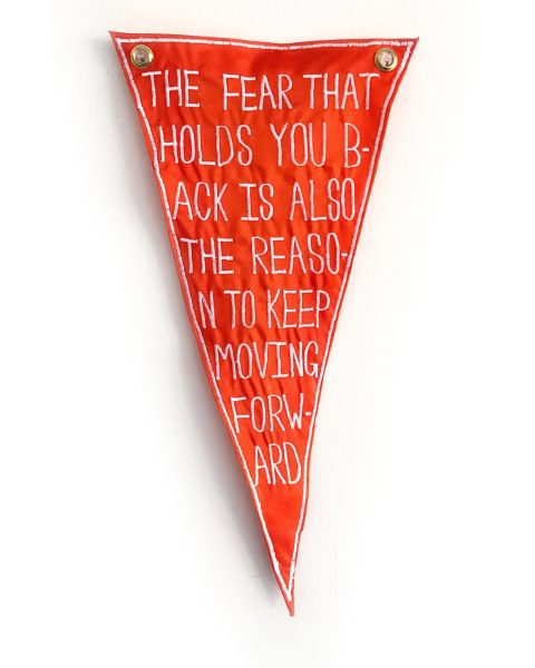 Red pennant with text reading 