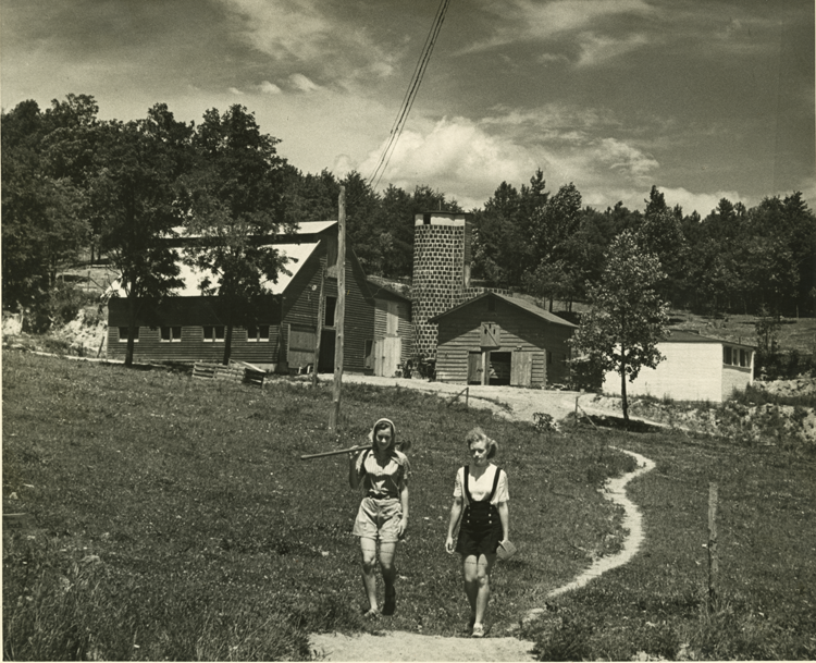 Students walking toward Black Mountain College barn and Silo