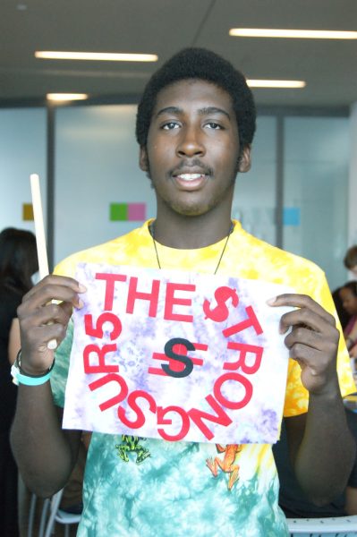Teens at 2012 ICA Teen Convening holding up their art