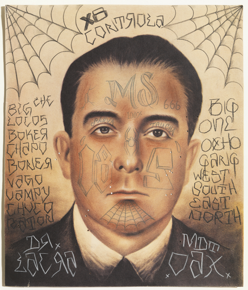 A drawing of ink on paper depicts a close-up portrait of a man with light skin, dark hair, and several facial tattoos dressed in a suit, against a background of written text and spider webs.