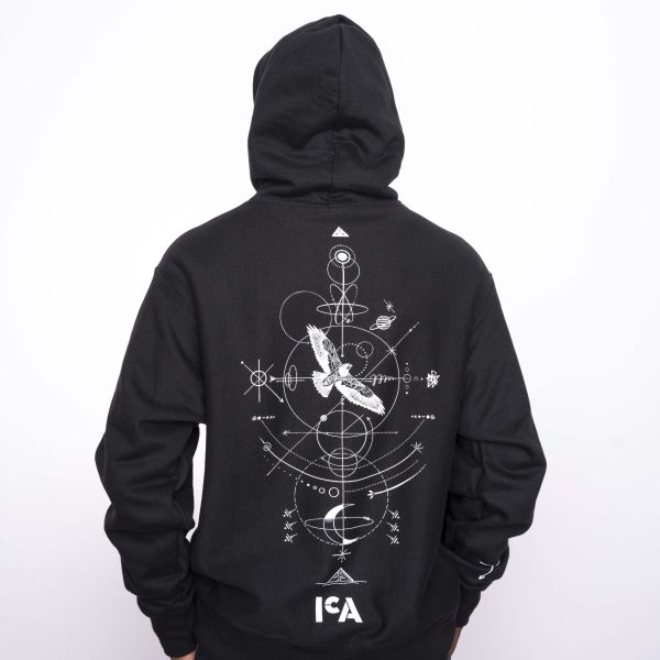 The back of a black hoodie with a delicate abstract design