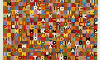 An embroidered square textile composed of a grid of bold, colorful letters.