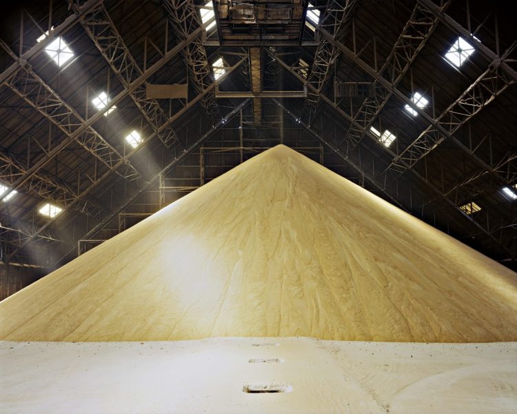 Interior industrial space with large yellow pile