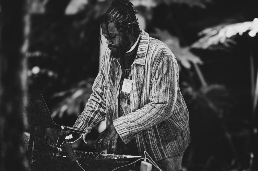 a black and white photo of a man djing