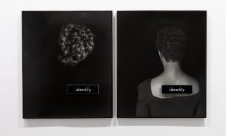 Two black-and-white photographs with black backgrounds, one of a section of dark, curly hair with a placard reading “identify” and one a portrait of a Black woman in a scoop-neck black top shown from the back with a placard reading “identity” affixed to the bare skin of her upper back.