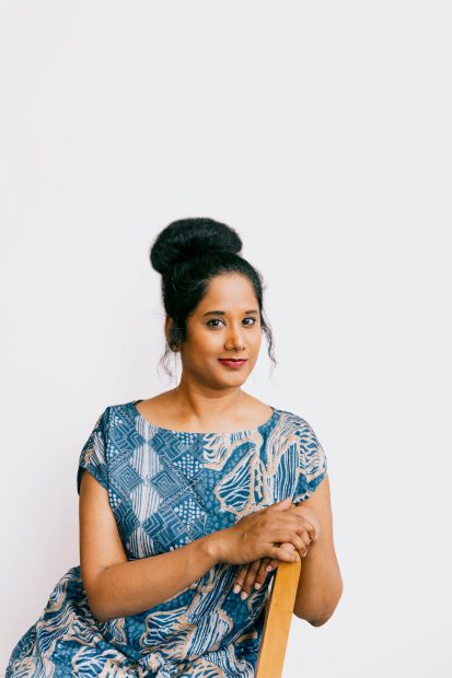 Headshot image of Anni Pullagura, Assistant Curator at the ICA/Boston, sitting
