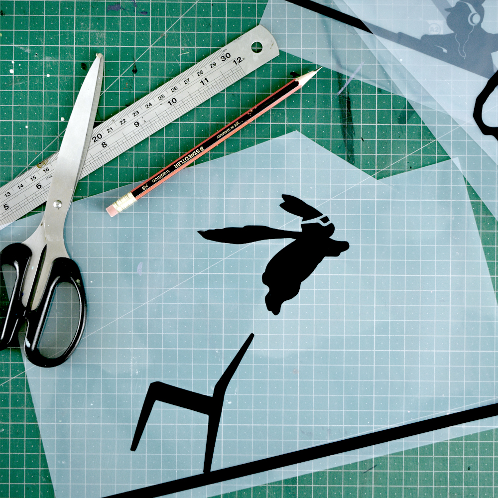Craft activity with print of a rabbit silhouette being cut up