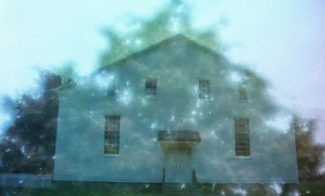 A manipulated photo of a simple house seemingly overlaying a photo of a tree.