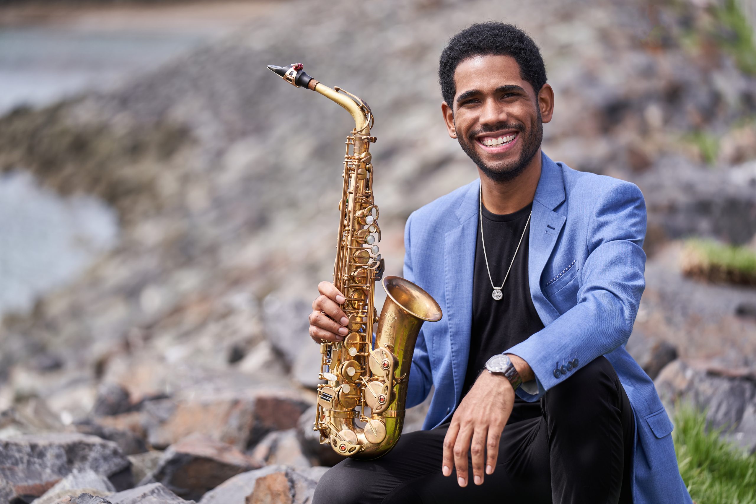 Headshot of Samuel Batista with his saxophone